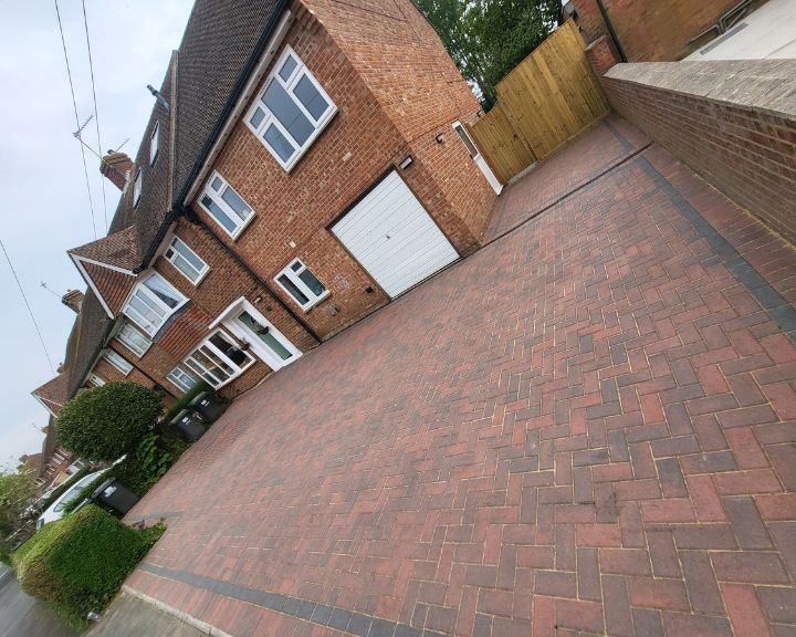 A new driveway that has been installed using paving stones.